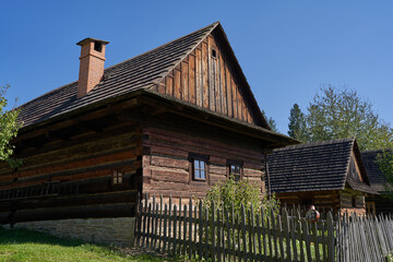 Fototapeta na wymiar Roznov pod Radhostem, Czech Republic - September 28, 2023 - the Wallachian village - wooden houses in rural countryside on a sunny autumn day