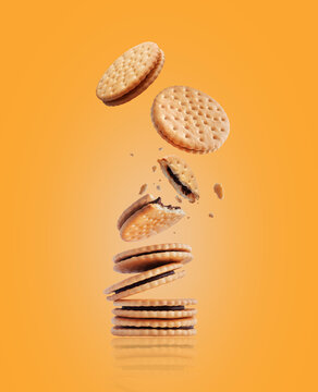 Whole and crushed crispy cookies with chocolate filling. Stack of crispy cookies on a yellow background