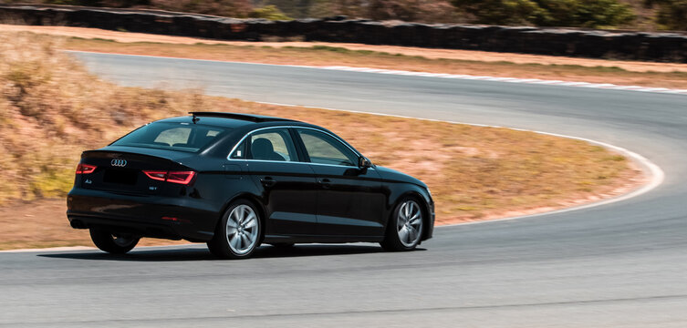 Black Audi A3 panning shot in a race track - High Resolution Image