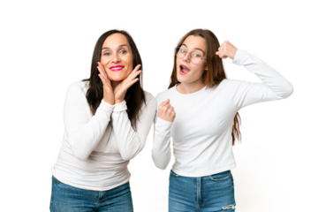 mother and daughter over isolated chroma key background celebrating a victory
