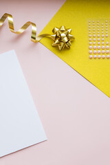 DIY Christmas Design. Decorative Card, Kraft Paper Envelopes, Greeting Cards on colorful Background. Holidays Mockup. composition with scissors, ribbon and stars, Top view, write message.