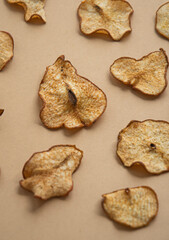 Dried pear slices on a light background. View from above.