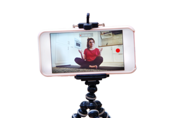 Record a video lesson on training sport at home for the channel on the Internet, isolated on a white background. Individual fitness in the home kitchen on isolation due to the flu virus pandemic.