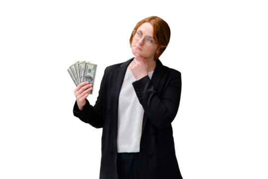 A teacher holds money in us dollars near a blackboard, isolated on a white background