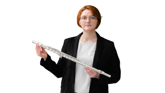 A music teacher holds a flute against an empty blackboard, isolated on a white background. Learning to play wind musical instruments