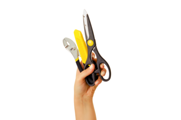 Scissors, pliers and a knife for cutting paper in hand on white background. Construction tools at arm's length, isolated on a white background