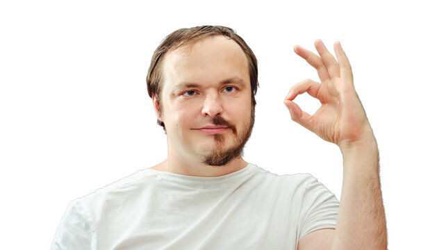 Adult man with a half beard smiling shows ok gesture. Concept of self-cutting and shaving during the flu epidemic