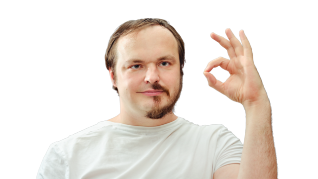 Adult man with a half beard smiling shows ok gesture. Concept of self-cutting and shaving during the flu epidemic