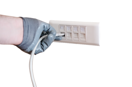 Connection to a computer network in the office, a gloved hand holds a cord for connecting to an Internet outlet, isolated on a white background.