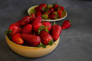strawberries in fresh fruit close-up with gray background