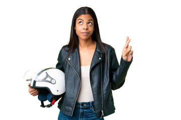 Young African American woman with a motorcycle helmet over isolated chroma key background with...