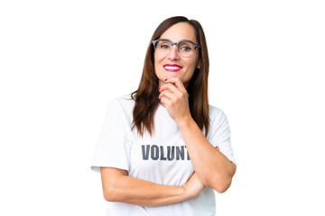 Middle age volunteer woman over isolated chroma key background with glasses and smiling