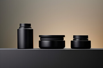 three black cosmetic jars stand on podiums of different heights