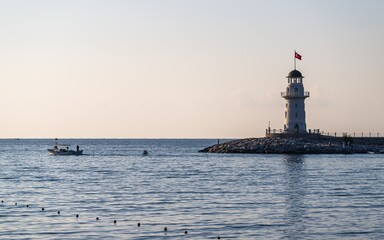 Fototapeta na wymiar Lighthouse and Marina in Alanya, Turkish Riviera on Mediterranean Coast, Antalya, Turkey