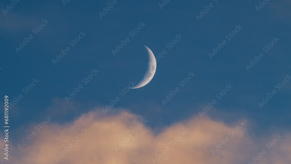 Wall mural orange clouds with blue sky and moon in christmas sky