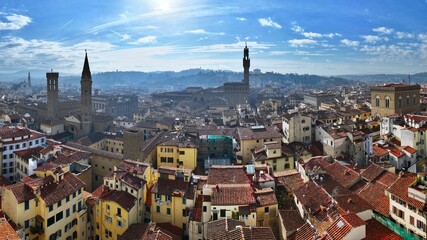 Aerial view of the city of Florence with the tower of Palazzo Vecchio, the seat of the municipality of Florence, in the center - obrazy, fototapety, plakaty