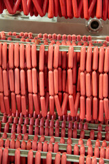 Fototapeta premium rack with sausages wiener and bratwurst , hotdog raw in the factory