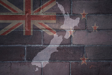 map and flag of new zealand on a old brick wall