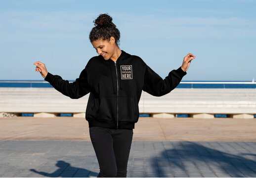 Mockup of carefree woman wearing customizable hoodie with arms out