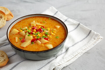 Homemade Corn Chowder in a Bowl, side view. Copy space.