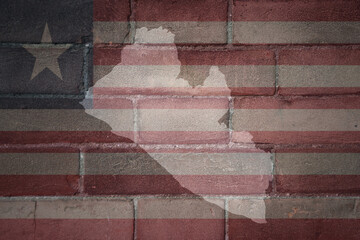 map and flag of liberia on a old brick wall