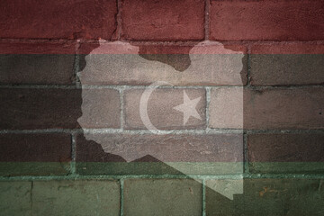 map and flag of libya on a old brick wall