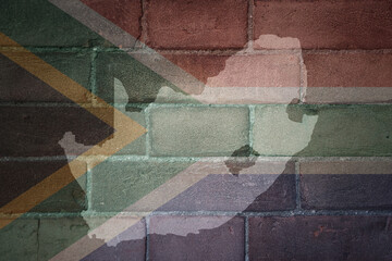 map and flag of south africa on a old brick wall