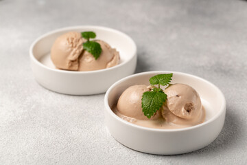 Baileys liqueur ice cream, cocoa, chocolate chips, mint sprig