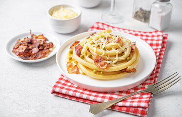 Bacon cheese green pea pasta in a plate