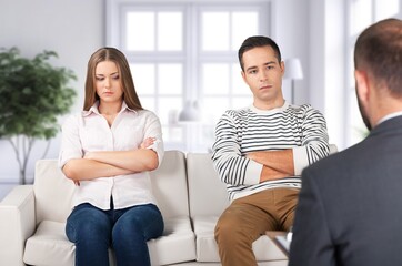 Young cad couple On Couch At Home, Conflicts And Problems