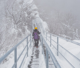 A tourist descending from the top of a mountain.