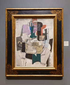 London, UK - May 2023: Fruit Dish, Bottle and Violin painting by Pablo Picasso, an example of Cubism, the early twentieth-century art movement initiated by Picasso, at National Gallery of London, UK