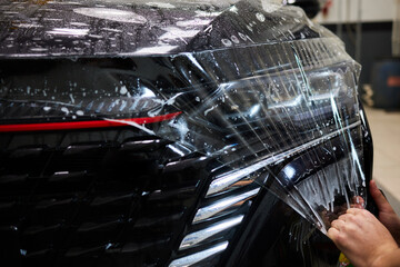 Protection of hood and front of the car with a colorless protective film.