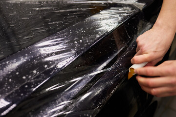 Protection of hood and front of the car with a colorless protective film.