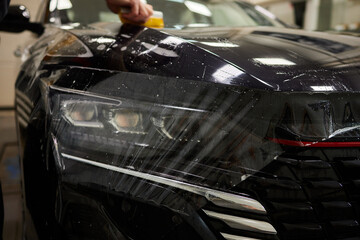 Protection of hood and front of the car with a colorless protective film.