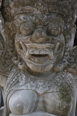 Fototapeta na wymiar Creativity in Carving: Close-up of Bali's Dwarapala Statue