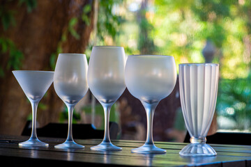 Variety of crystal glasses for different types of drinks: wines, juices and drinks