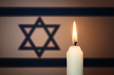 Burning candle and national Israel flag Remembrance Day