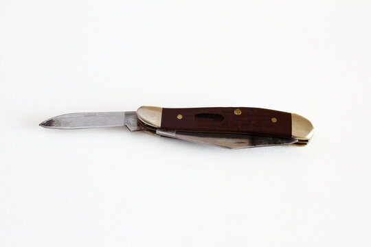 vintage old used folding knife isolated on white background