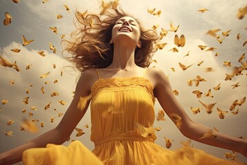 A woman in a yellow dress, arms outstretched, surrounded by butterflies under a cloudy sky.