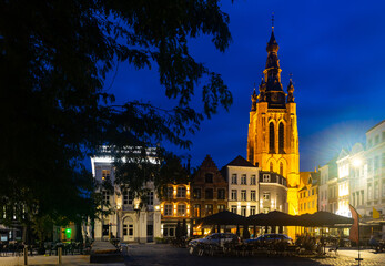 Evening central Grote Markt square with a view of the bell tower of St. Martin Church in Kortrijk, Belgium