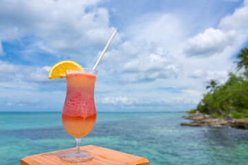 Travel background with drinks Bocal on Caribbean beach.