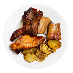 Appetizing roasted rabbit pieces with vegetable garnish of fried potatoes. Delicious and satisfying homemade dinner. Isolated over white background