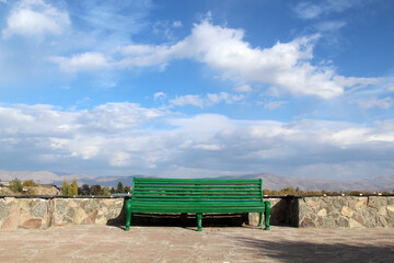 old wooden bench on a terrace in the mountains