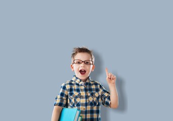 Smiling child student boy with mathematical symbols