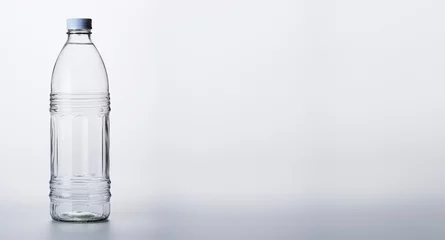Foto op Plexiglas bottle of mineral water on white background © Kordiush