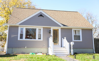 houses and american homes showing mortgage rates impact suburban homes, symbolizing financial strain amidst inflation, reflecting worry and value fluctuations