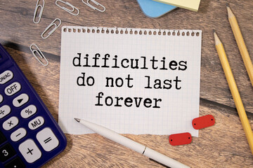 difficulties do not last forever. text on paper. text on notepad on white background. near the...
