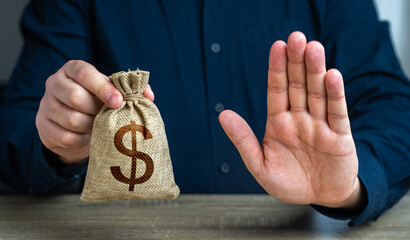 Stop gesture and dollar money bag. The man does not approve of the transaction or loan. Financial...