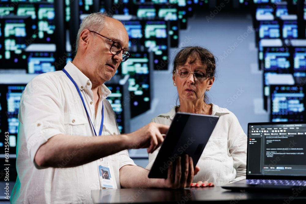 Poster data storage company executives running analysis on mainframes used for managing databases, hosting 